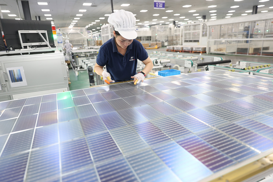 Workers assemble solar cells for export in the Ganyu Economic Development Zone in Lianyungang, Jiangsu province, on Aug. 28. Photo: VCG