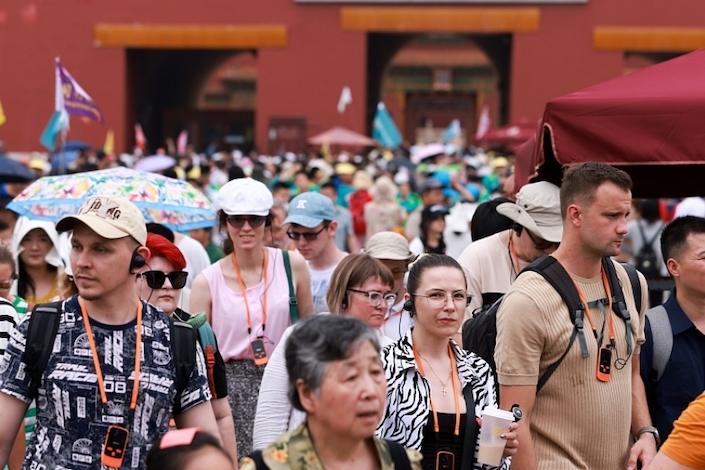 Foreign tourists at the Forbidden City in Beijing on July 9, 2024.