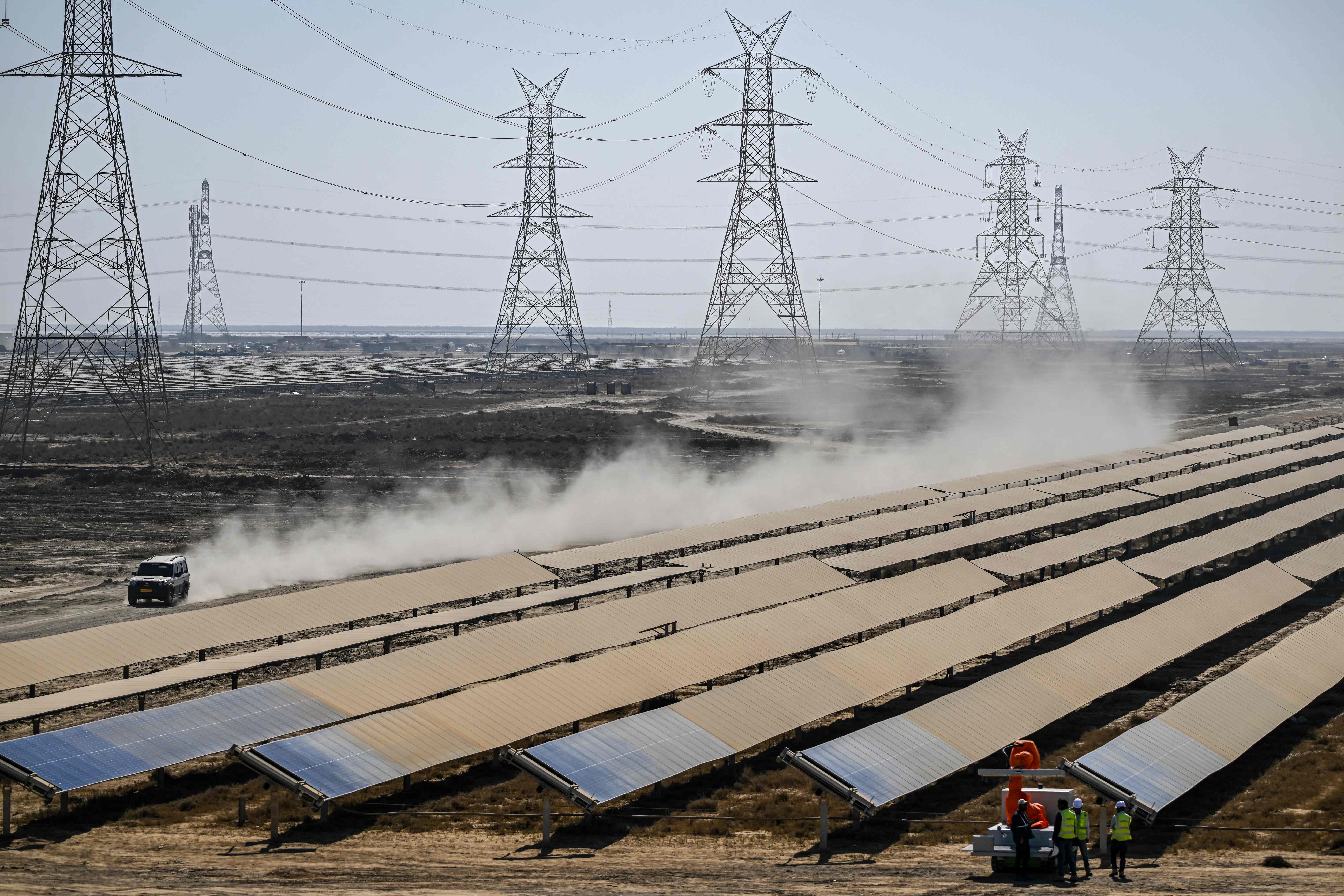 Workers install solar panels in a village in Kutch district of Gujarat, India, on Jan. 12. Photo: VCG